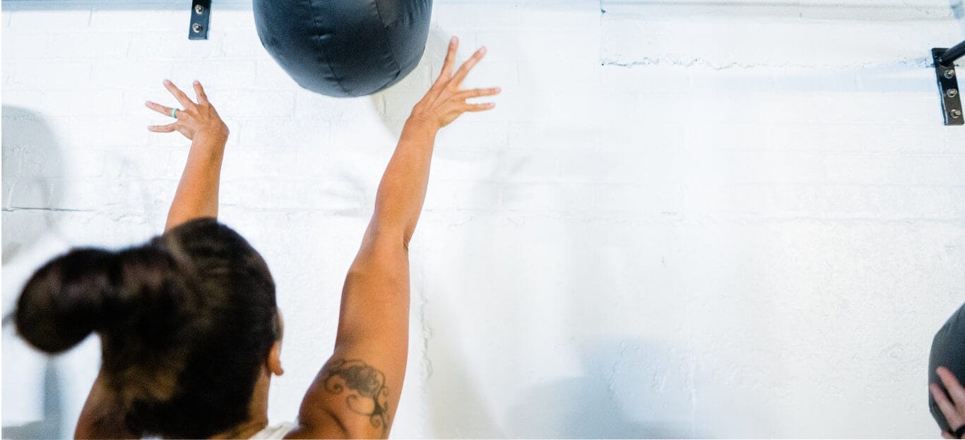 Woman throwing wall ball
